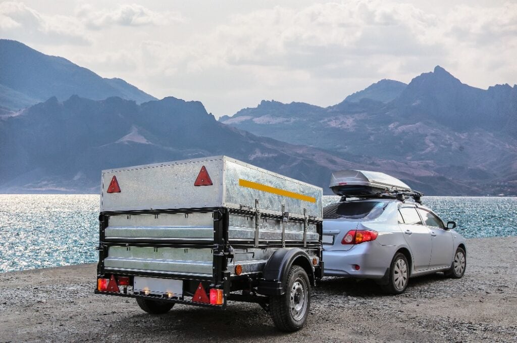 Car trailer by the sea