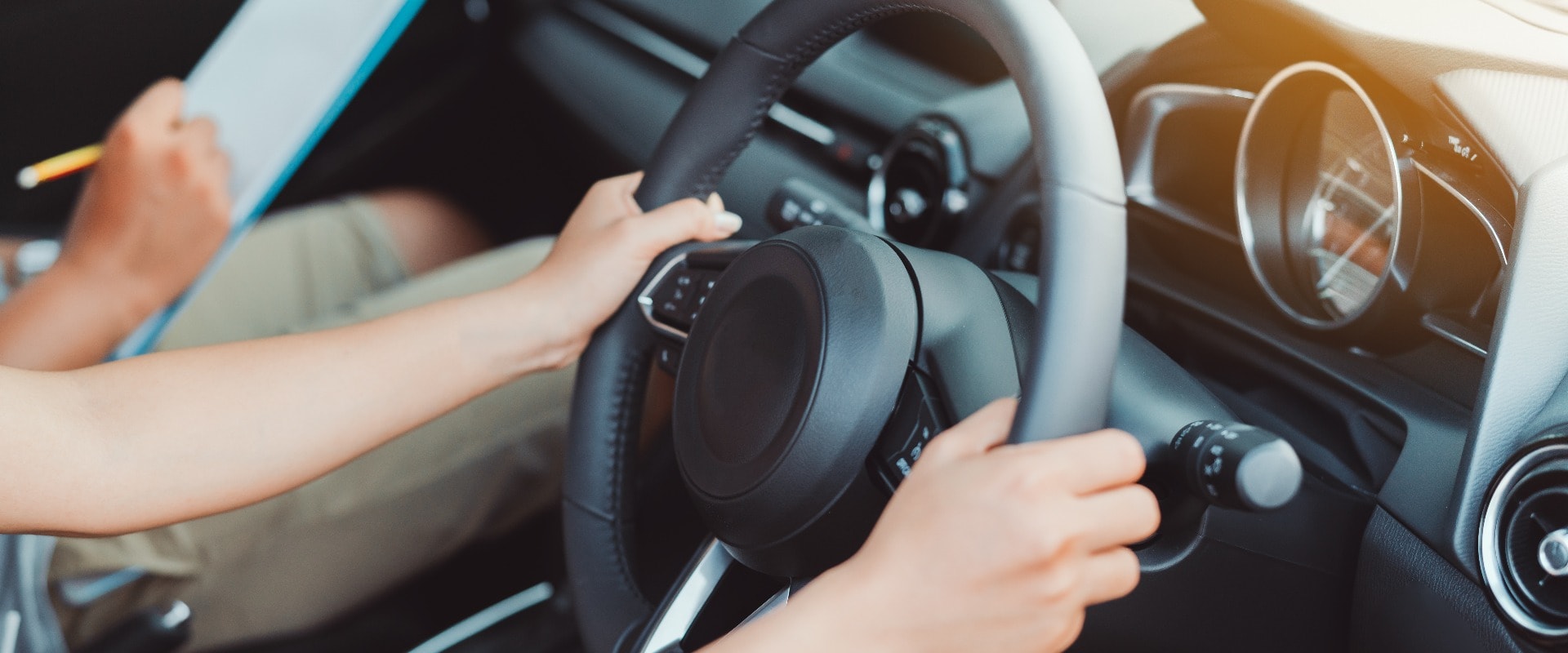 Woman practice driving car exam driver licence control steering wheel education and learn on street road by driving instructor teaching at school drive transportation safety travel, people lifestyle
